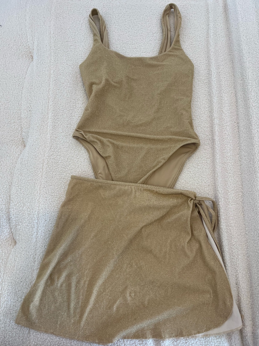 Aerie One-Piece Cheekiest Swimsuit in Beige/Tan and matching wrap skirt.